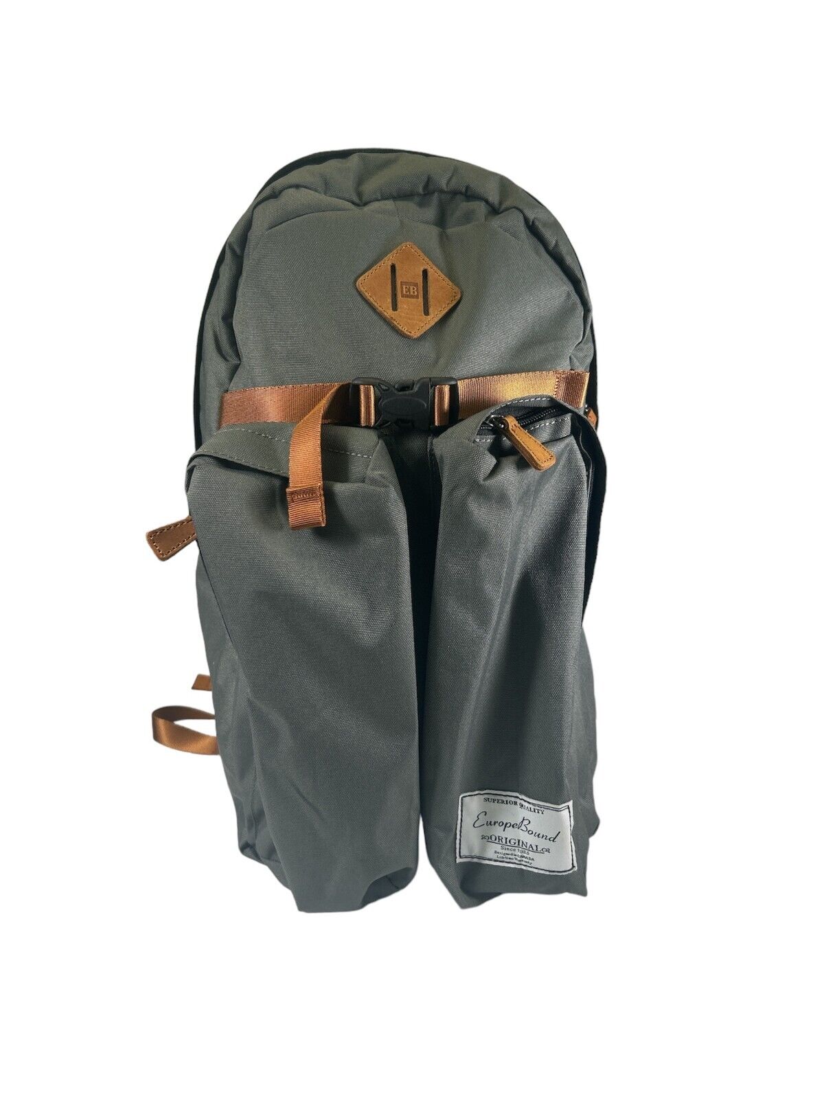 A green Europe Bound Day Hiker backpack with a 32L main compartment, two front pockets, and a visible brand logo on the top center.