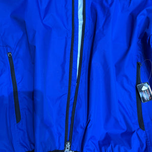 Europe Bound Unisex Waterproof Breathable Raincoats with Stash Pocket in Blue All Front Zippers Close-Up | ScoutTech Outfitters