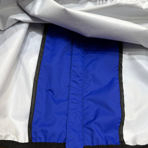 Europe Bound Unisex Waterproof Breathable Raincoats with Stash Pocket in Blue Interior Storm Flap Close-Up | ScoutTech Outfitters Mississauga Store