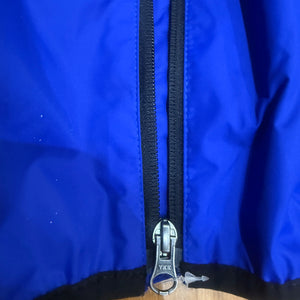 Europe Bound Unisex Waterproof Breathable Raincoats with Stash Pocket in Blue YKK Front Zip Close-Up | ScoutTech Outfitters Mississauga Store