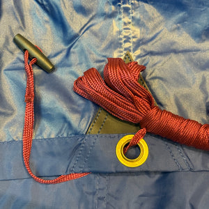 Europe Bound Universal Rain Tarp Dark Blue Close Up of taped seams, red guylines, dongle and grommet | ScoutTech Outfitters