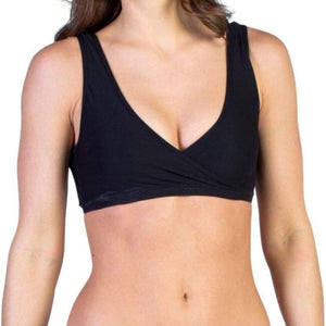 Exofficio Give-N-Go Cross Over Bras in Black on a model front view with Exofficio Branding On Elasticized Band | ScoutTech Outfitters Mississauga Store