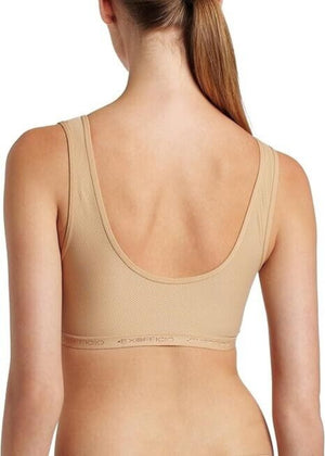 Exofficio Give-N-Go Cross Over Bras in Nude Tan on a model back view with Exofficio Branding On Elasticized Band | ScoutTech Outfitters Mississauga Store