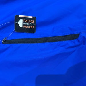 Europe Bound Unisex Waterproof Breathable Raincoats with Stash Pocket in Blue Zippered Stash Pocket Close-Up | ScoutTech Outfitters Mississauga Store