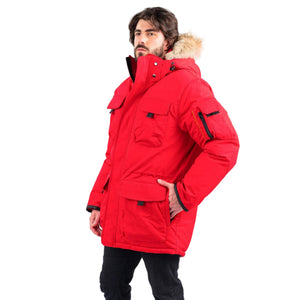 Outdoor Survival Canada OSC Men's Atka -40 Down Parka in Red Alert on Model with Left Hand in Pocket View | ScoutTech Outfitters