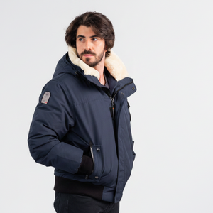Outdoor Survival Canada OSC Men's Desna US -20 Urban Down Bomber Jacket on Model in Cold Lake Blue Right Side OSC Brand Badge View | ScoutTech Outfitters Mississauga Store