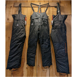 Outdoor Survival Canada OSC Unisex Klin Down Bib Pants in Black Hanging on a Wooden Wall Showing Multiple Angles | ScoutTech Outfitters Mississauga Store