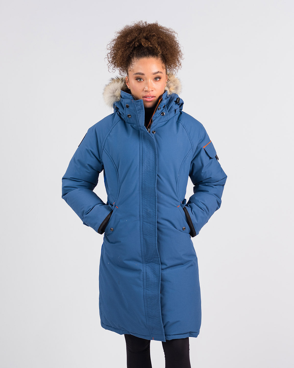 Outdoor Survival Canada OSC Women's Karima -40°C/F Down Parka in Indigo Blue on Model with Hands in Pockets | ScoutTech Outfitters Mississauga Store