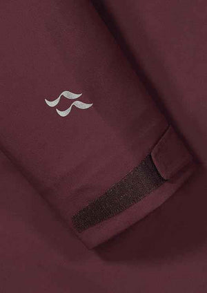 Rab Women's Kangri 3-Layer GORE-TEX Rain Shell Jackets in Burgundy Cuff and Logo Close-Up | ScoutTech
