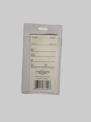 White card with text and barcode on a black surface