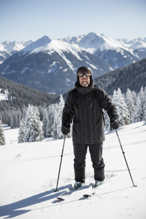 Salomon Men's Zero Insulated Ski Jackets in Black Action Photo on a Male Model Skiing Down an Alpine Hillside with a Pine Forest in the Background | ScoutTech Outfitters Mississauga Store