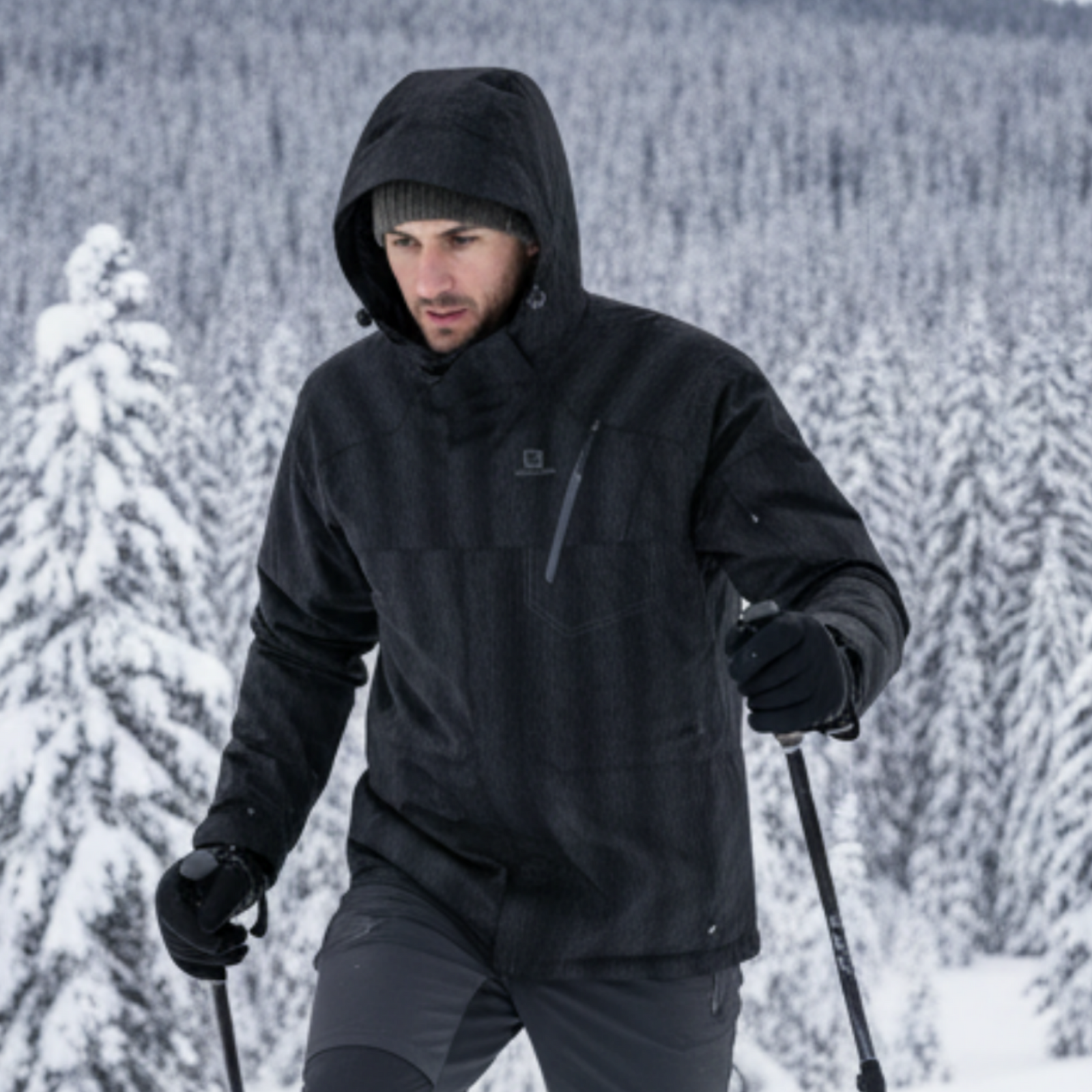 Salomon Men's Zero Insulated Ski Jackets in Black Close Up Action Photo on a Male Model Size Small | ScoutTech Outfitters Mississauga Store