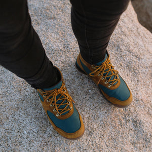 Danner Women's Retro Style Jag Leather Nylon Blend Waterproof Hiking Boots on Model Standing on Rock | ScoutTech Outfitters Mississauga Store