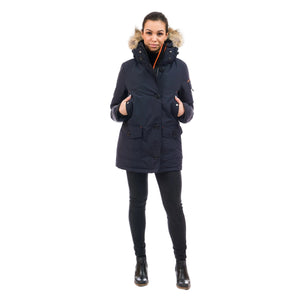 Outdoor Survival Canada OSC Women's Kasa UC -20°C Urban Coyote Down Parka in Cold Lake Blue Posing with Hands in Hand Warmer Pockets Front Side | ScoutTech Outfitters Mississauga Store