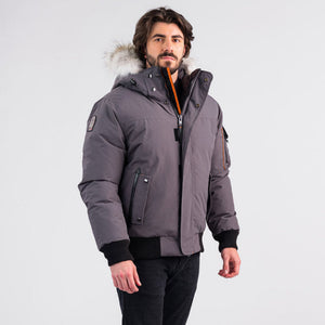 Outdoor Survival Canada OSC Men's Desna -40 Down Bomber Jacket in Charcoal Gray Front Partially Open to Show Orange Strip | ScoutTech Outfitters
