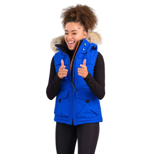 Outdoor Survival Canada OSC Miki Women's -40°C/F Down Vest with Hood in Arctic Blue Modelled in an Action Pose | ScoutTech Outfitters Mississauga Store