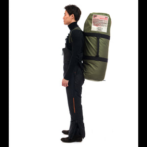 Outdoor Survival Canada OSC Unisex Klin Down Bib Pants in Black Side View on a Male Model that is carrying an OSC -60C Down Sleeping Bag | ScoutTech Outfitters Mississauga Store
