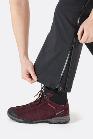 Rab Women's Kangri GTX Rain Pants in Black with Close-Up of Ankle Zip Closure | ScoutTech Mississauga Store
