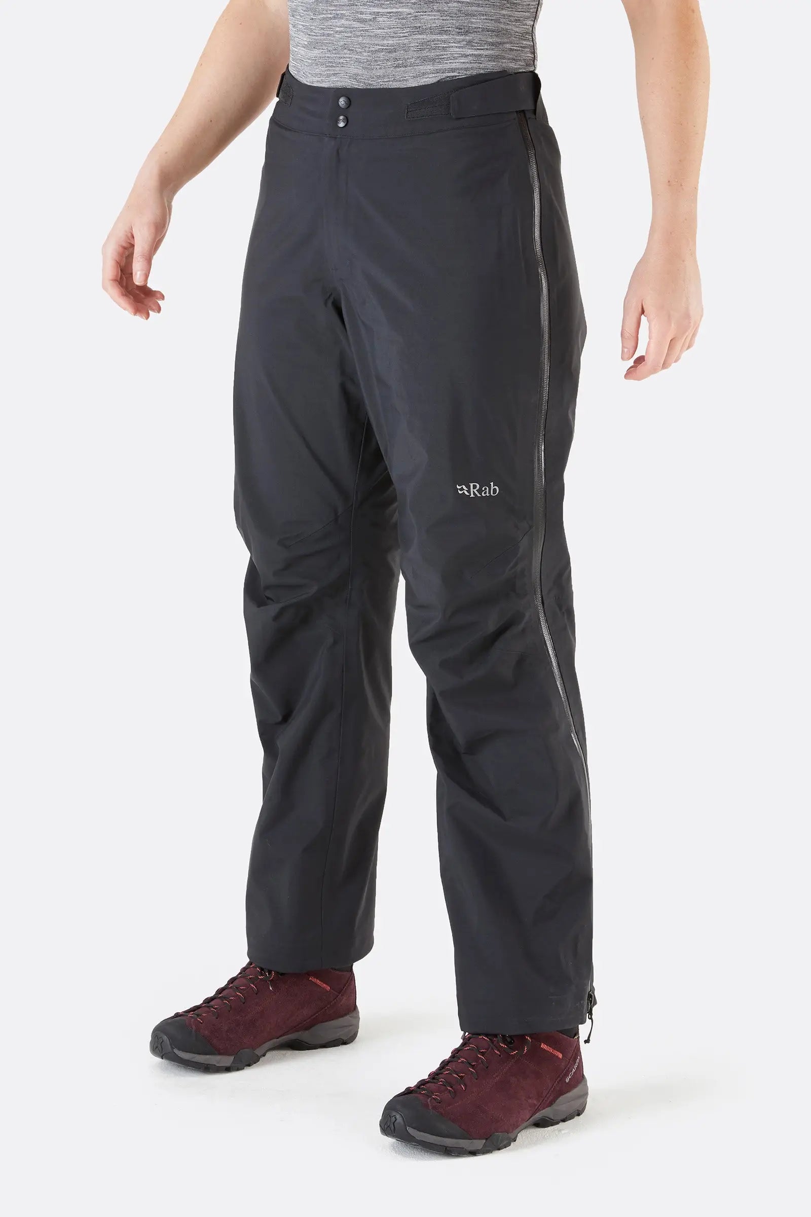 Rab Women's Kangri GTX Rain Pants in Black with Full Zipper Front View with RAB Logo | ScoutTech Outfitters Mississauga Store